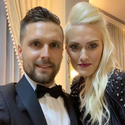 Alexandra Mary Hirschi and her husband, Nik Hirschi posing for a photo shoot. 